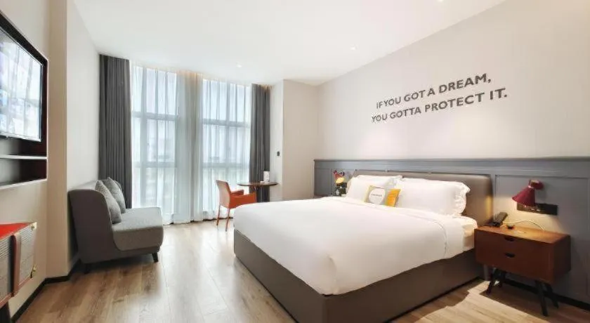 Bed in Premier City Comfort Hotel Hechi Luocheng Central Plaza