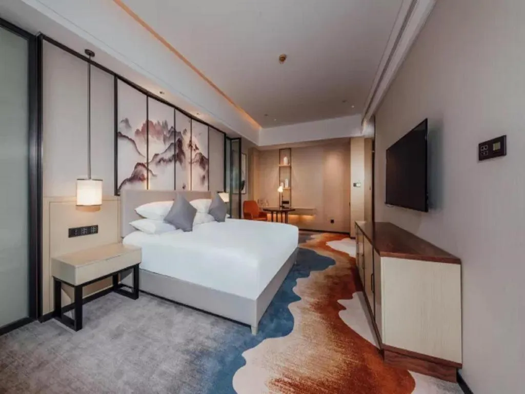 Bed in New Century Grand Hotel Ningbo Zhongdu