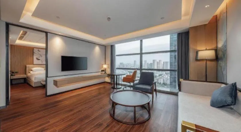 Bed in New Century Grand Hotel Ningbo Zhongdu