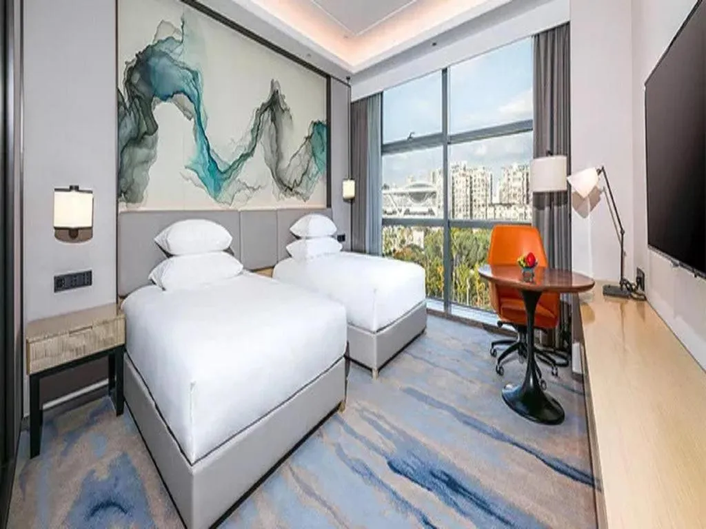 Bed in New Century Grand Hotel Ningbo Zhongdu