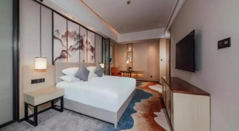 Bed in New Century Grand Hotel Ningbo Zhongdu