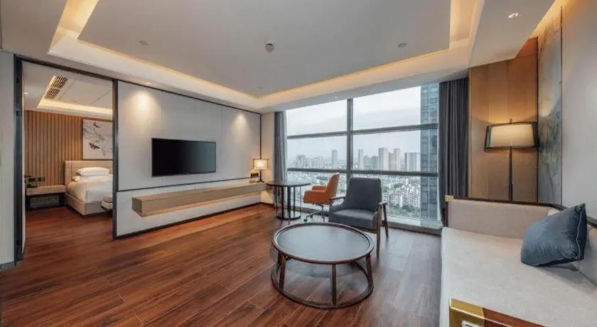 Bed in New Century Grand Hotel Ningbo Zhongdu