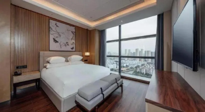 Bed in New Century Grand Hotel Ningbo Zhongdu