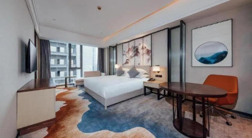 Bed in New Century Grand Hotel Ningbo Zhongdu