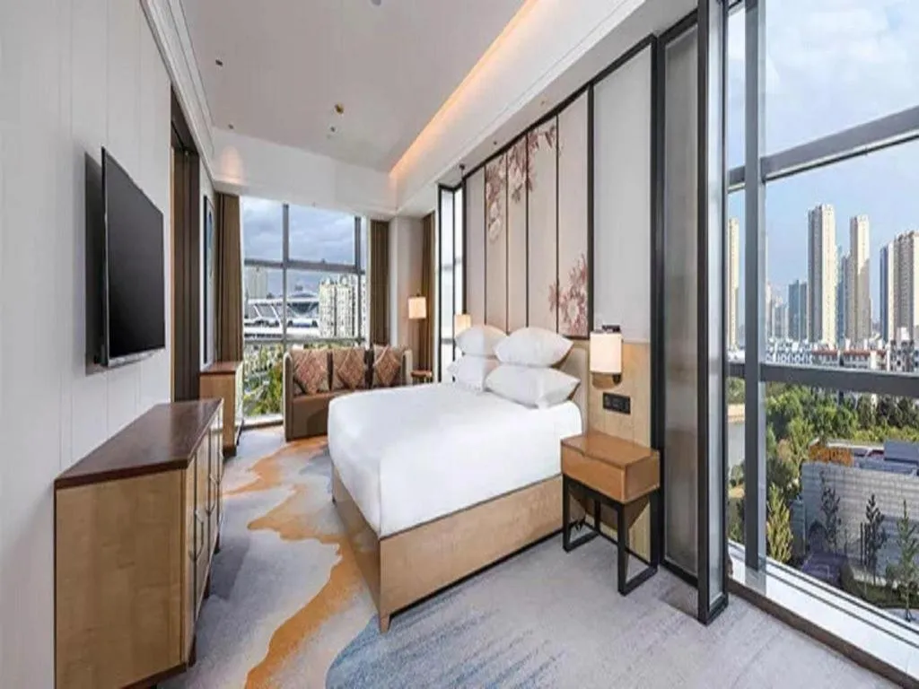 Bed in New Century Grand Hotel Ningbo Zhongdu