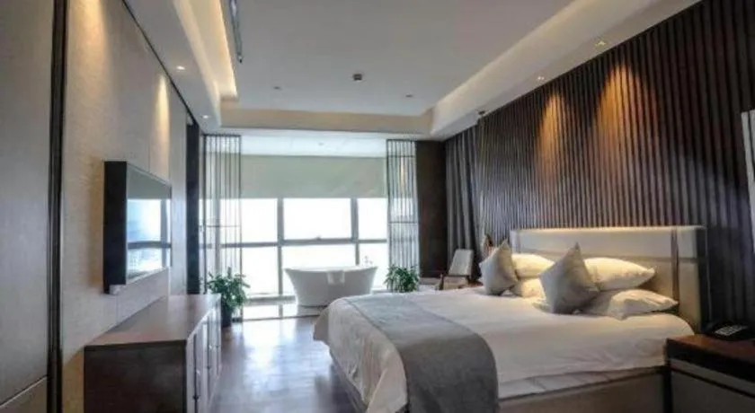 Bed in New Century Grand Hotel Ningbo Zhongdu