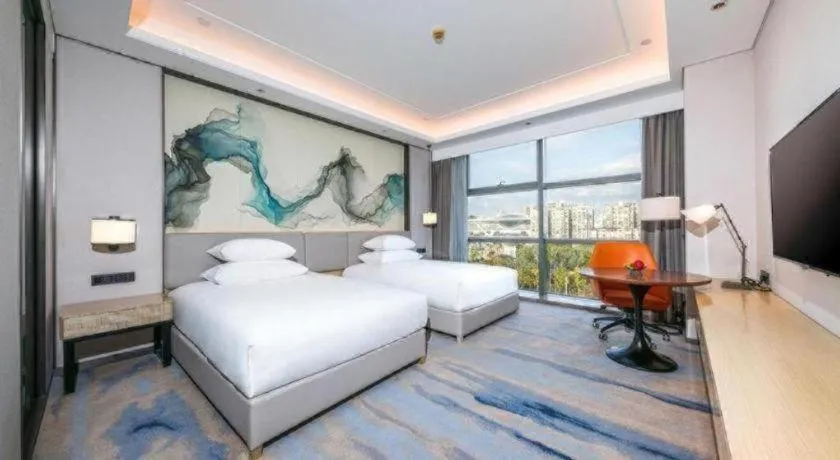 Bed in New Century Grand Hotel Ningbo Zhongdu
