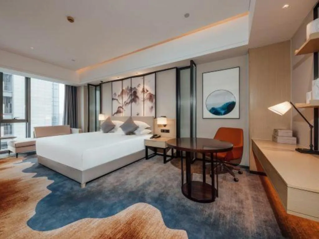 Bed in New Century Grand Hotel Ningbo Zhongdu