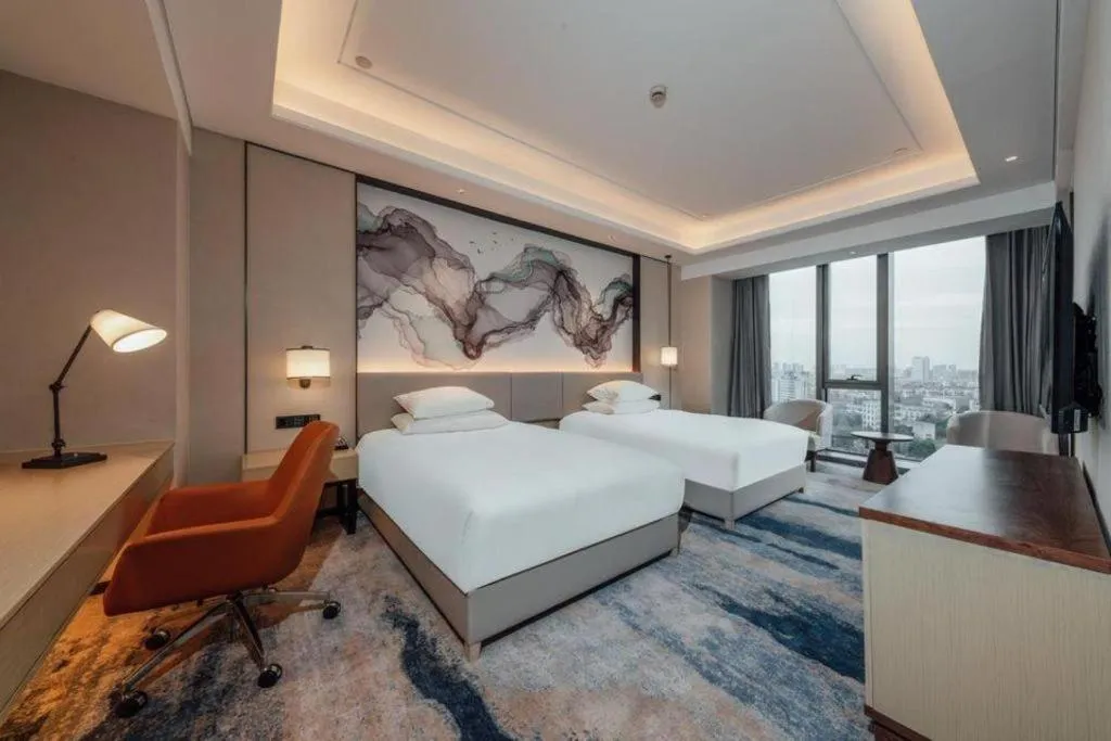 Bed in New Century Grand Hotel Ningbo Zhongdu
