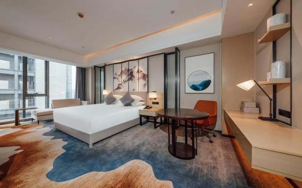 Bed in New Century Grand Hotel Ningbo Zhongdu