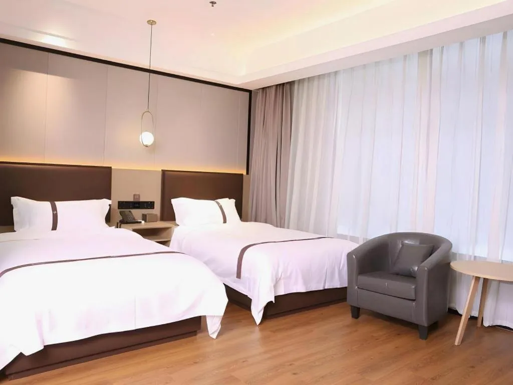 Bed in Gya Hotel Beijing Shunyi Yanjing Bridge