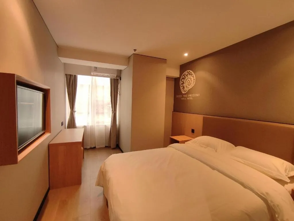 Bed in Shell Hotel Beijing Shunyi District Shunyi Metro Station