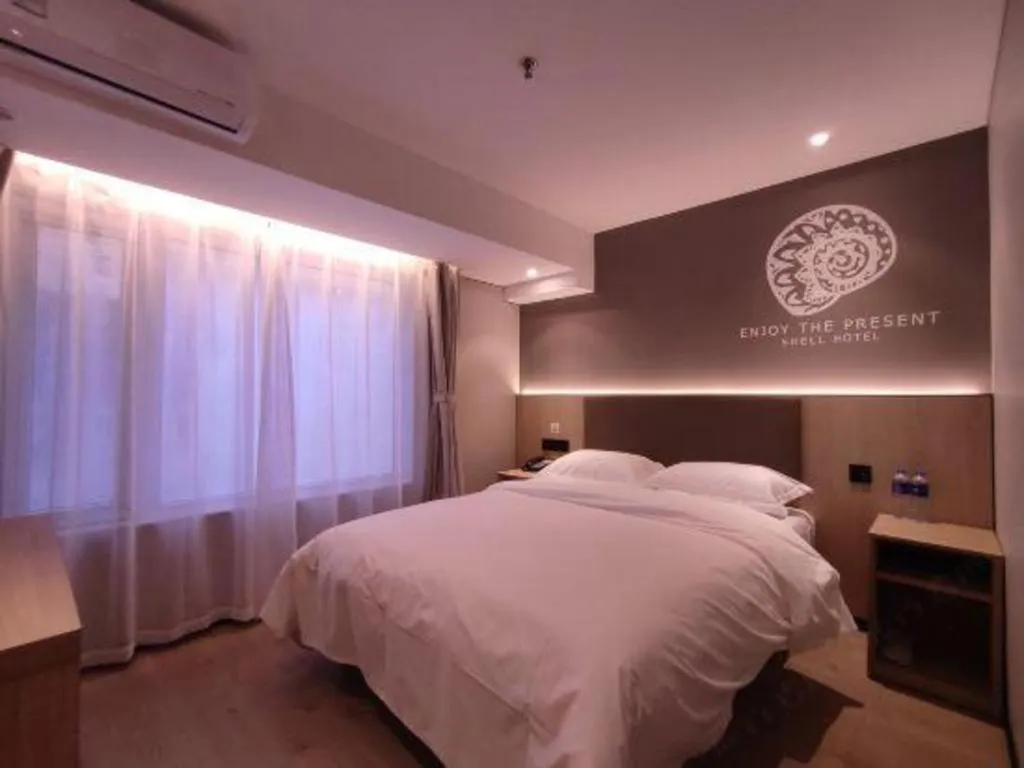 Bed in Shell Hotel Beijing Shunyi District Shunyi Metro Station