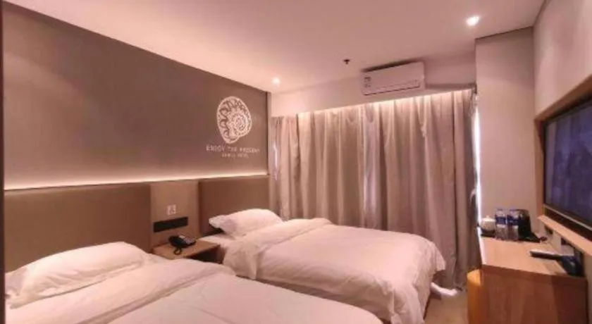 Bed in Shell Hotel Beijing Shunyi District Shunyi Metro Station