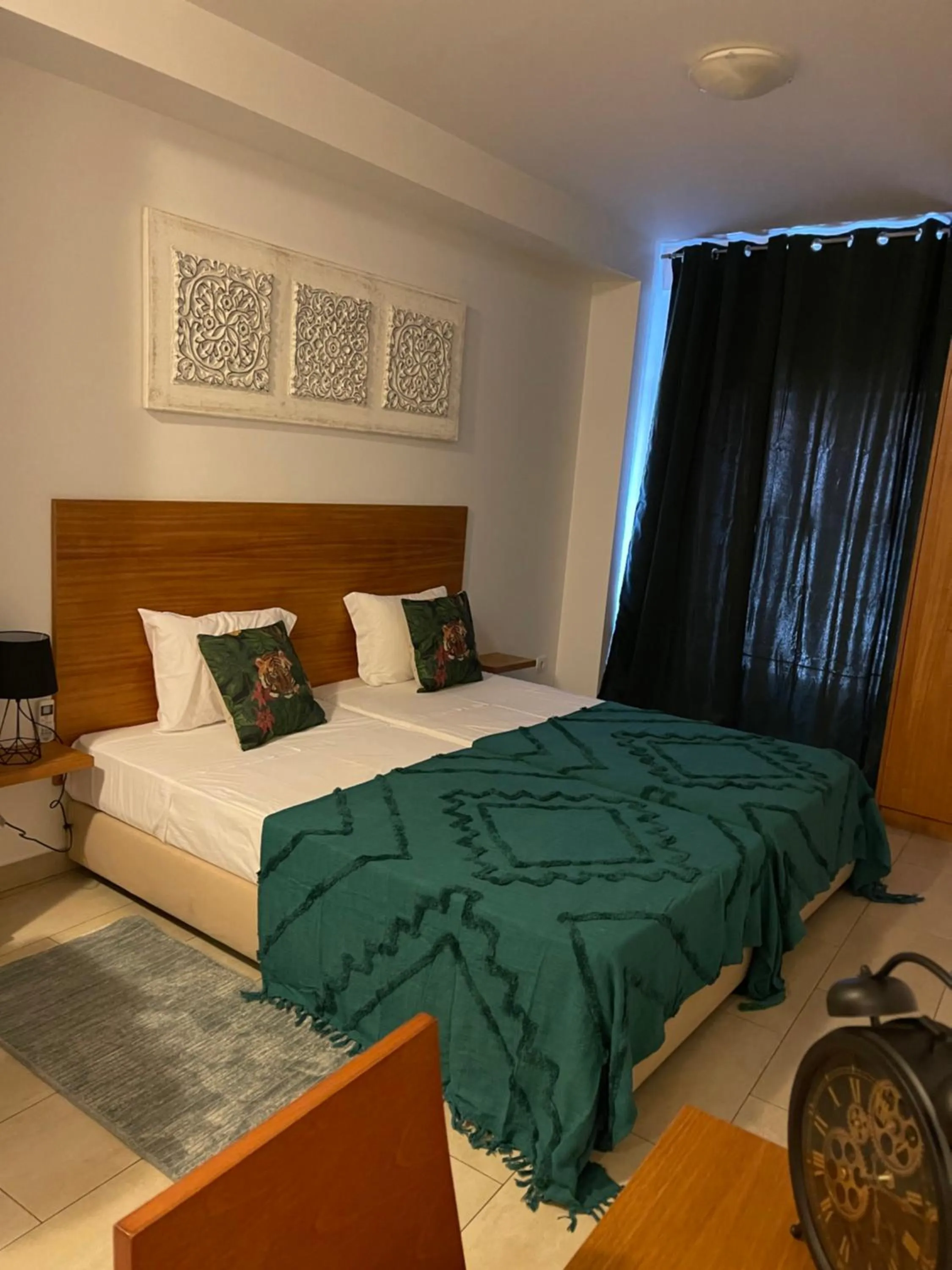 Bed in Esmeralda Holidays Apartments