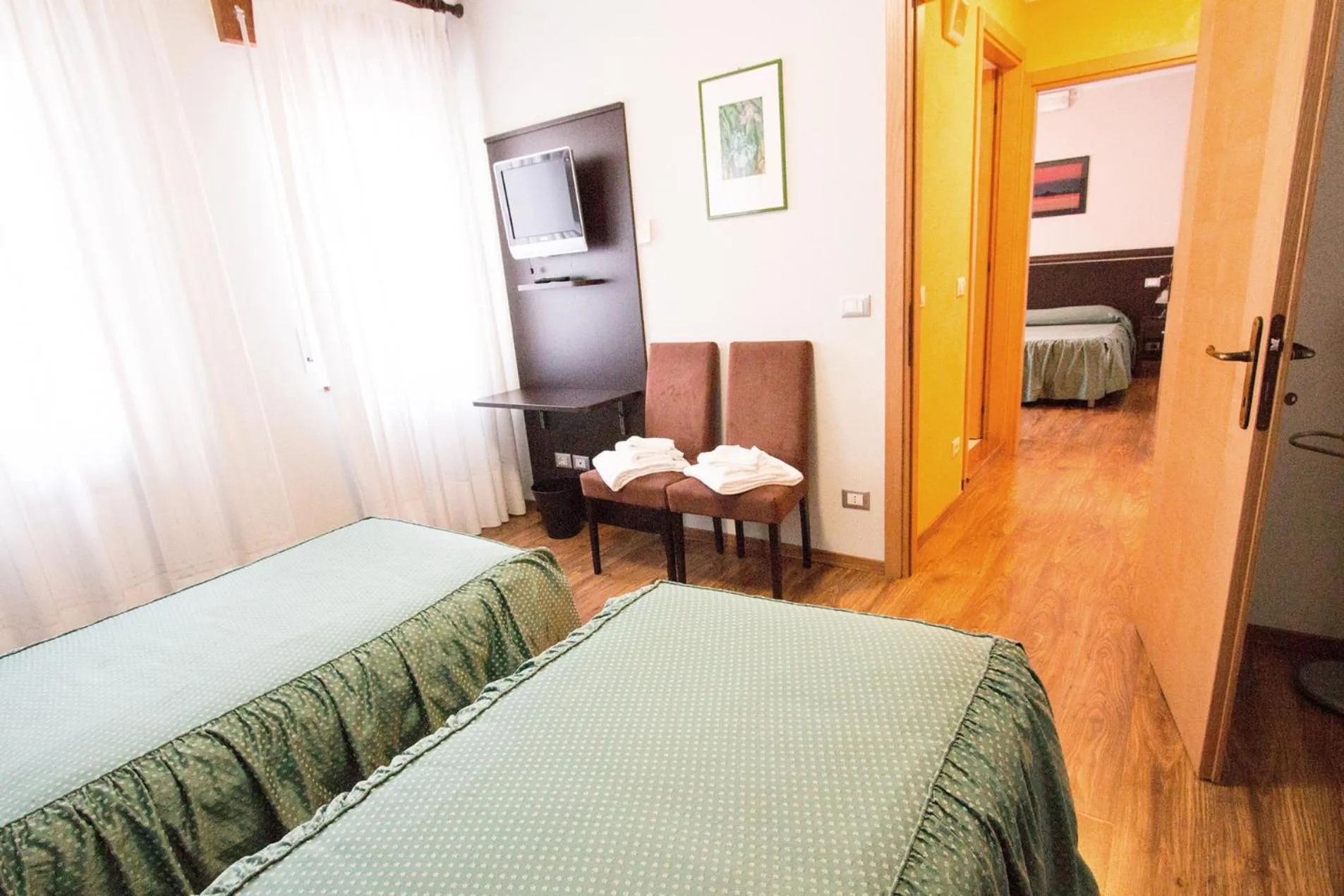 Bed in Al Benvenuto Hotel & Restaurant