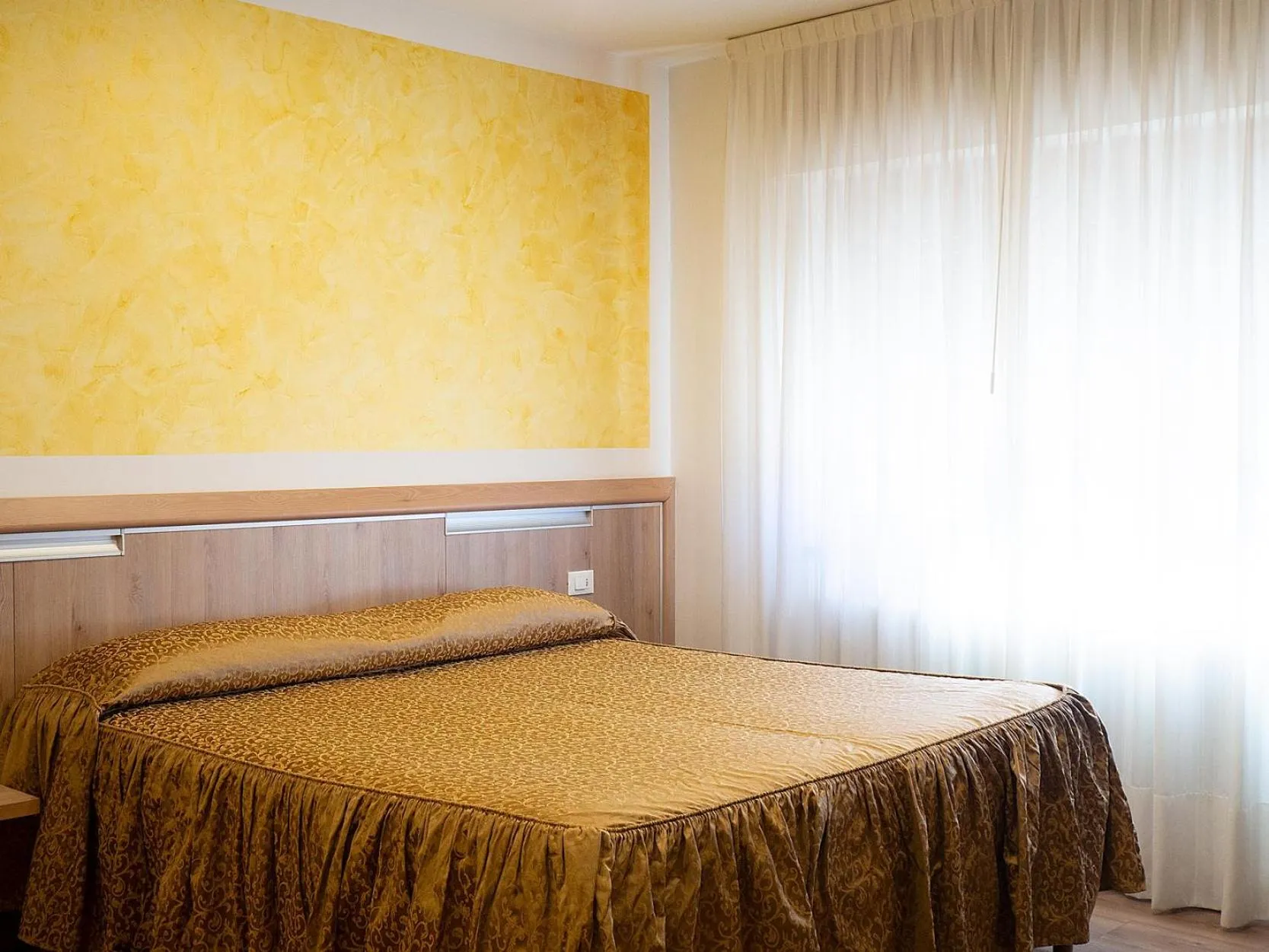 Bed in Al Benvenuto Hotel & Restaurant