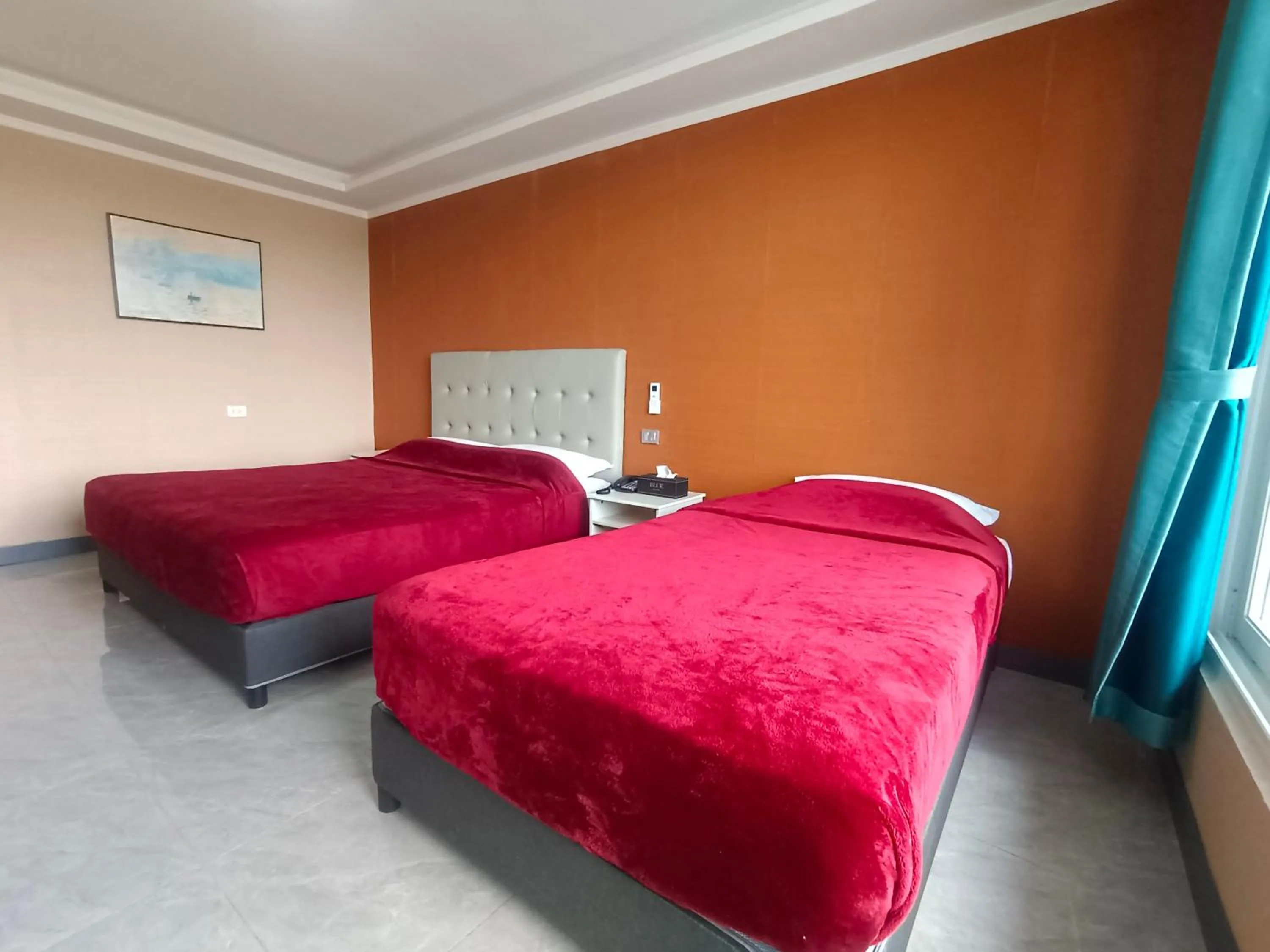 Bed in Blue Hotel and Resort