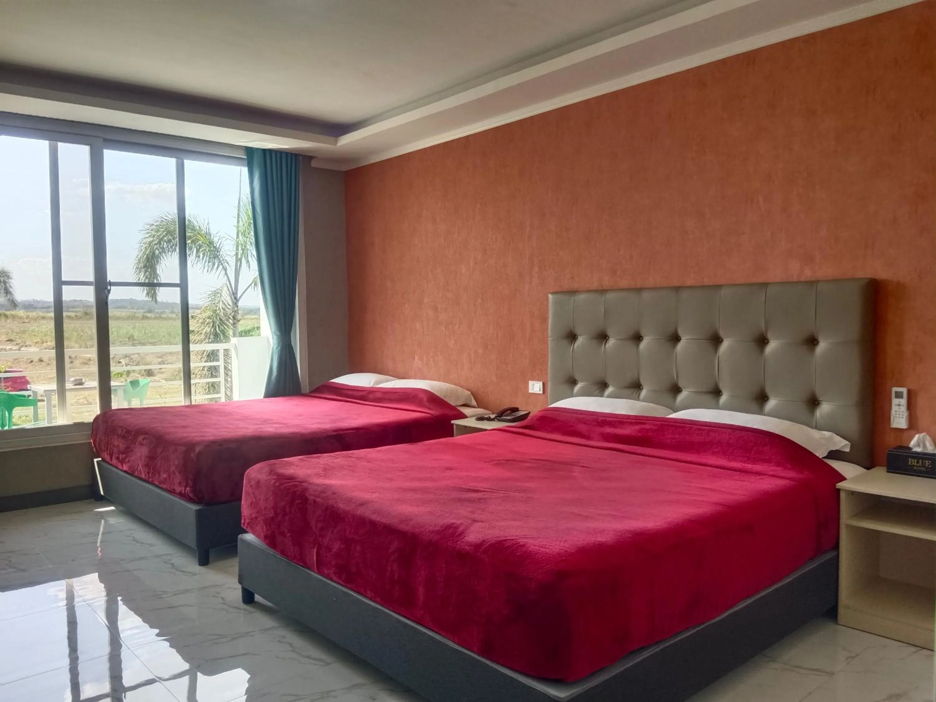 Bed in Blue Hotel and Resort