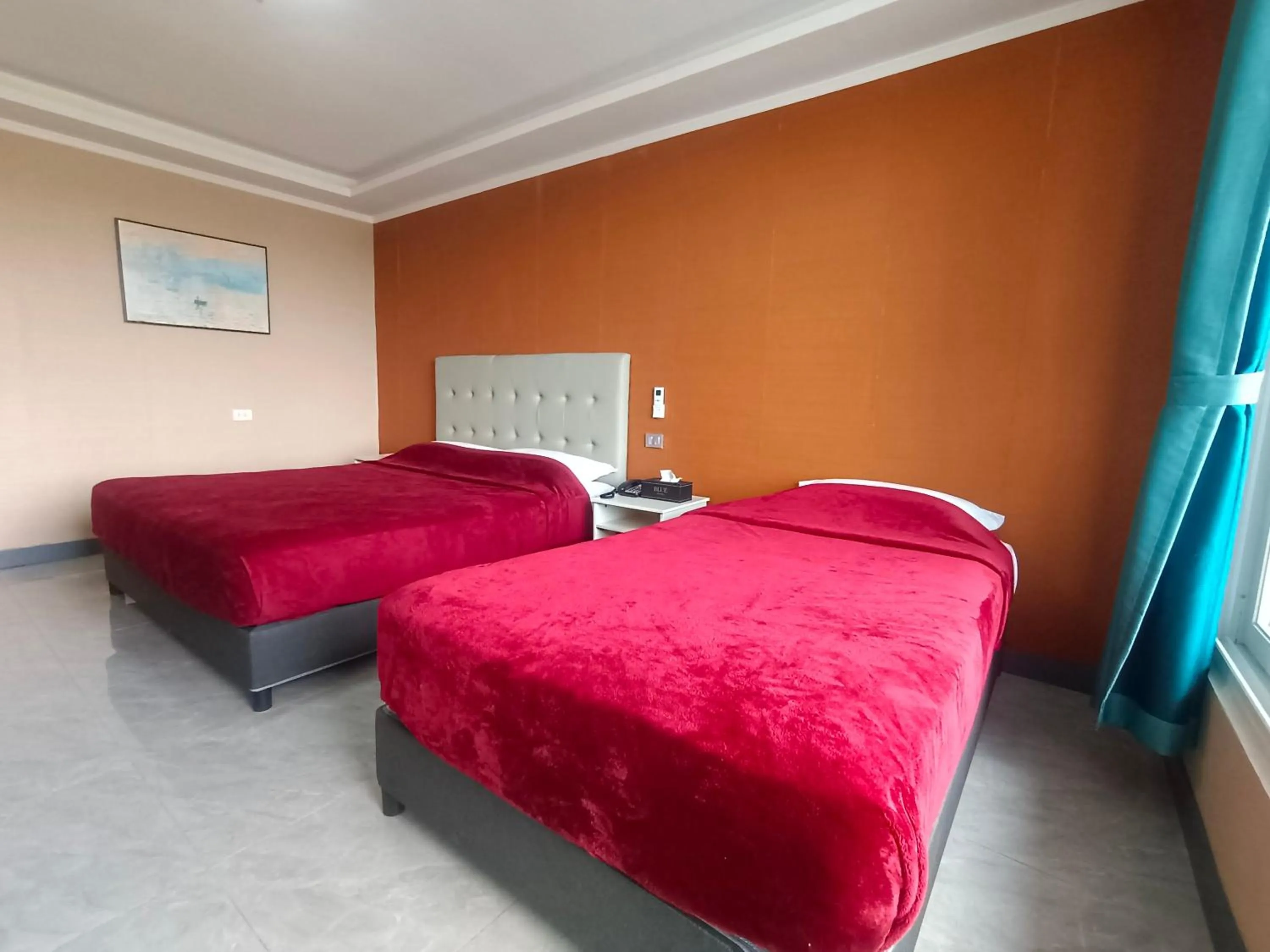 Bed in Blue Hotel and Resort