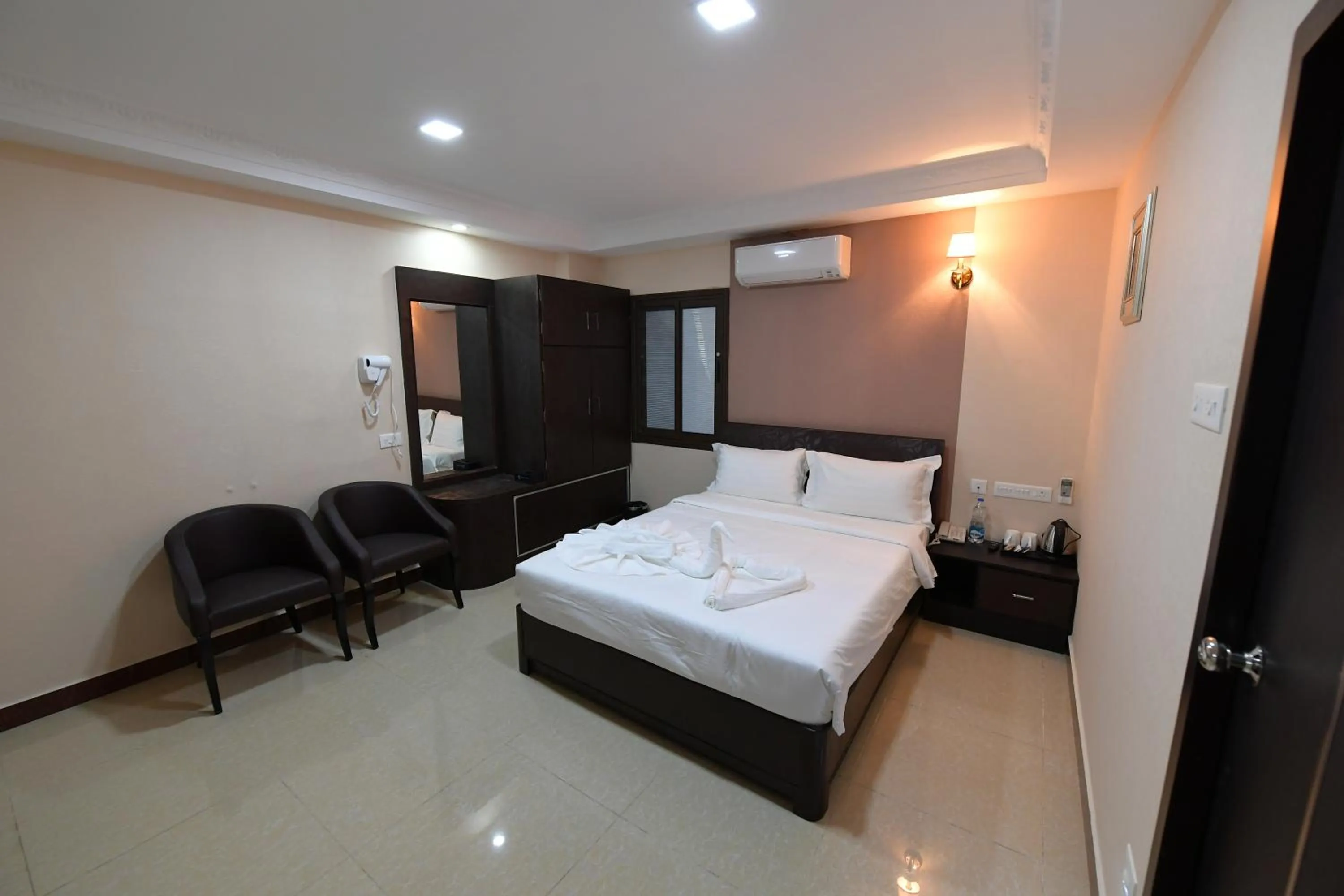 Bed in Coastal Grand Hotel Sampath