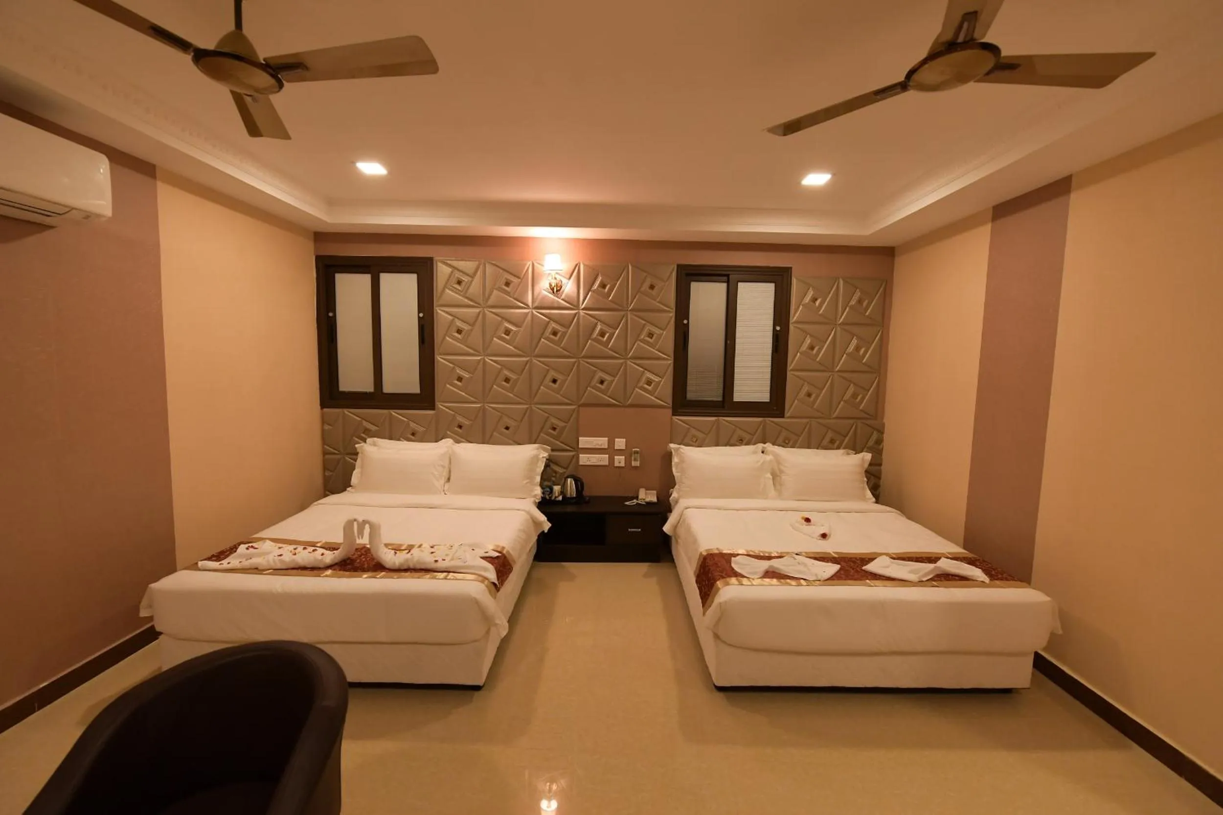 Bed in Coastal Grand Hotel Sampath