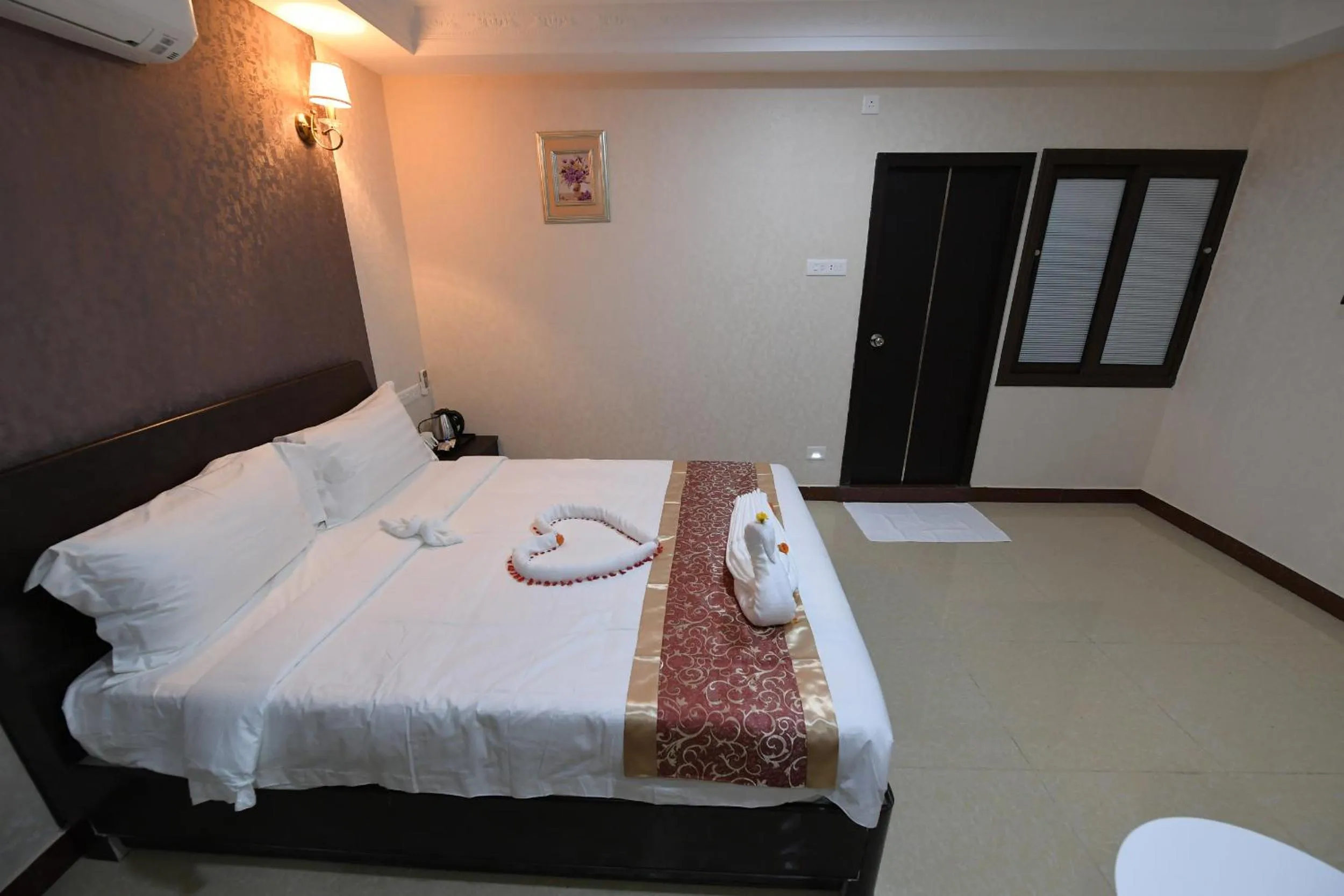 Photo of the whole room, Bed in Coastal Grand Hotel Sampath
