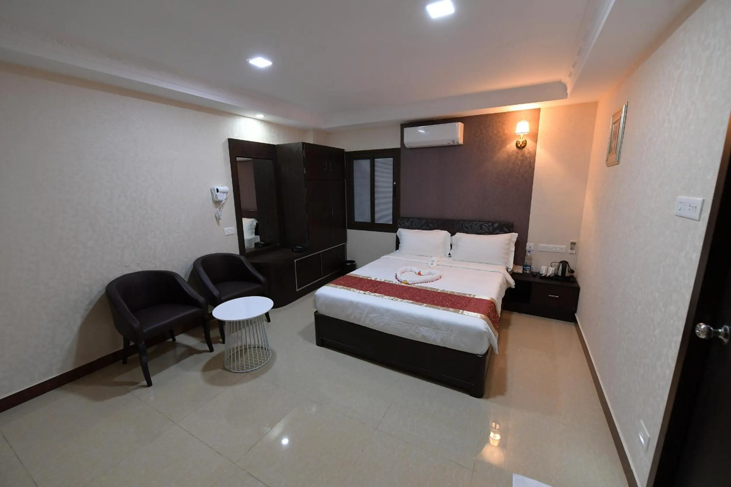 Bed in Coastal Grand Hotel Sampath