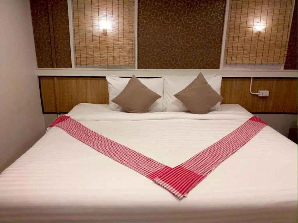 Bed in THOUSAND-TEN THOUSAND HOTEL