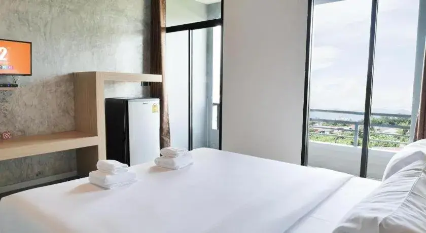 Bed in B2 Chiang Rai Phahonyothin Boutique & Budget Hotel Bed in B2 Chiang Rai Phahonyothin Boutique & Budget Hotel