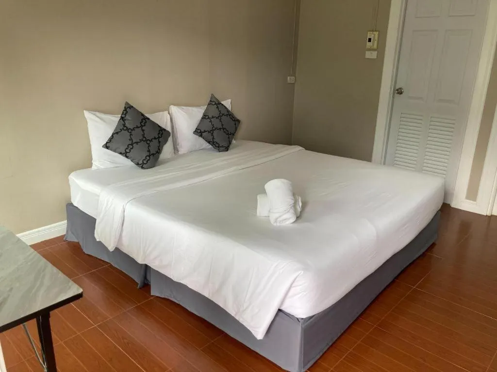 Bed in Thong Prachok Hotel