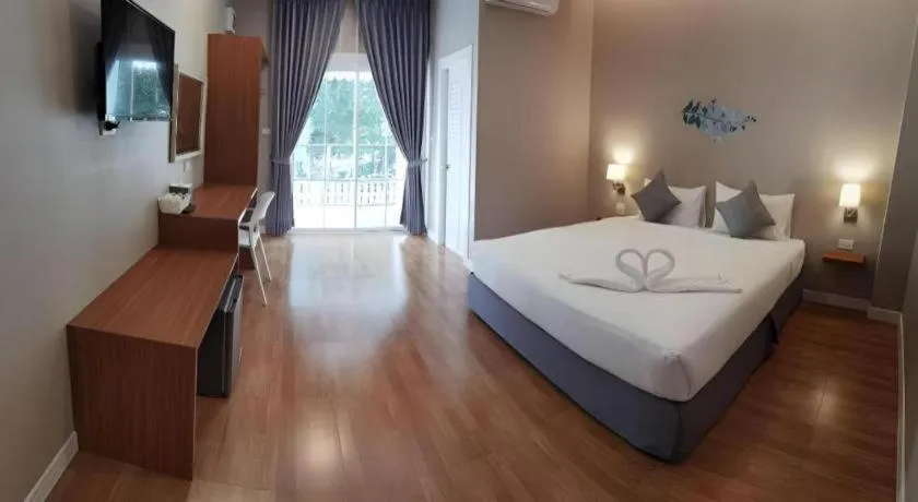 Bed in Thong Prachok Hotel