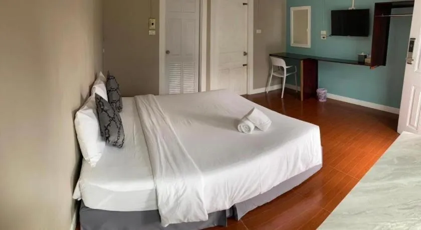 Bed in Thong Prachok Hotel