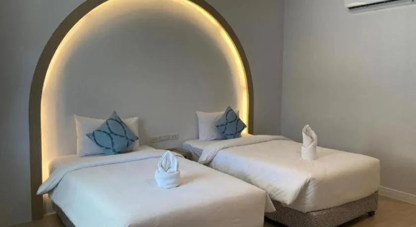 Bed in Thong Prachok Hotel