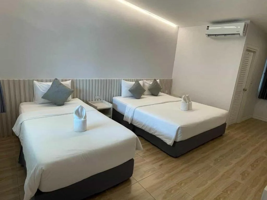 Bed in Thong Prachok Hotel