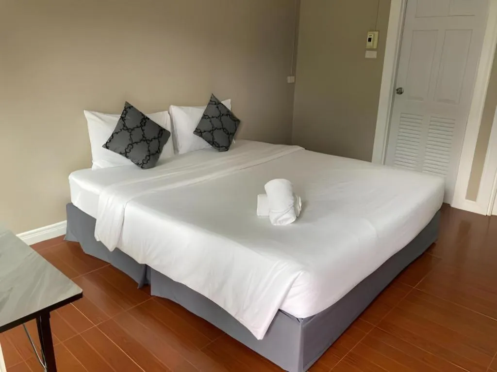 Bed in Thong Prachok Hotel