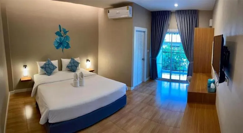 Bed in Thong Prachok Hotel