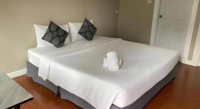 Bed in Thong Prachok Hotel