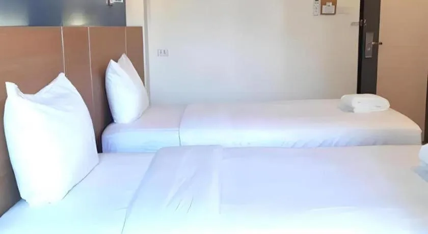 Bed in Ceniq Hotel