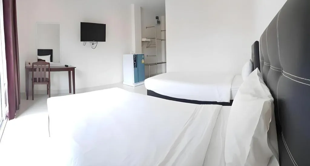 Bed in Niwtara Place Lom Sak Hotel