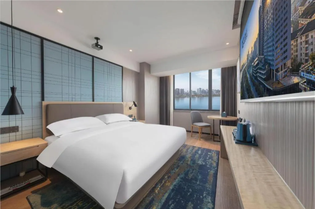 Bed in Echarm Hotel Hanzhong Wetland Park