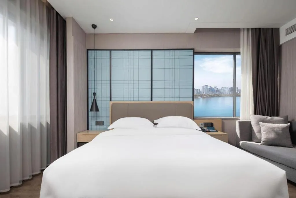 Bed in Echarm Hotel Hanzhong Wetland Park