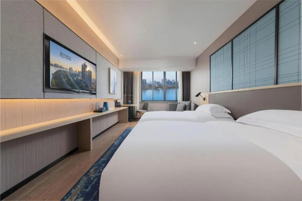 Bed in Echarm Hotel Hanzhong Wetland Park