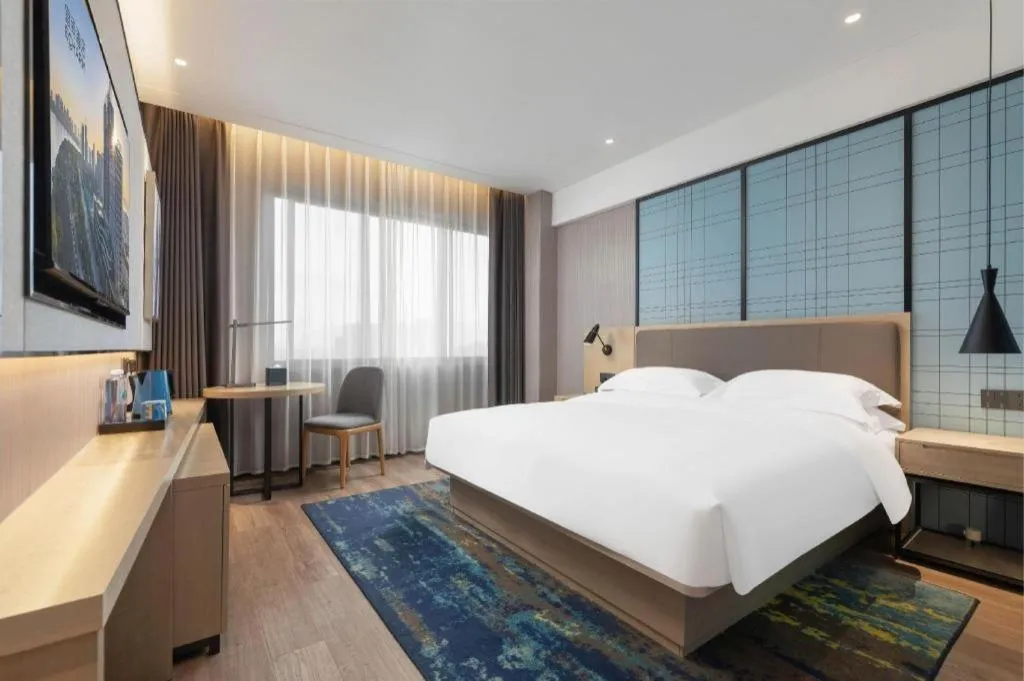Bed in Echarm Hotel Hanzhong Wetland Park