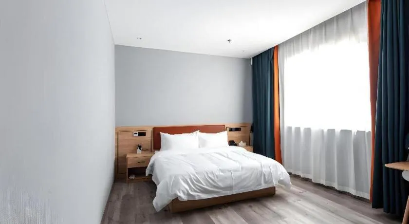 Bed in Borrman Hotel Jiangyin Zhouzhuang