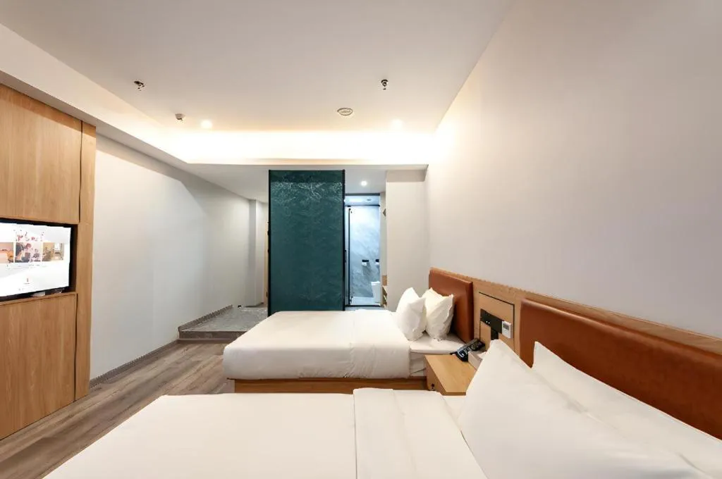 Bed in Borrman Hotel Jiangyin Zhouzhuang