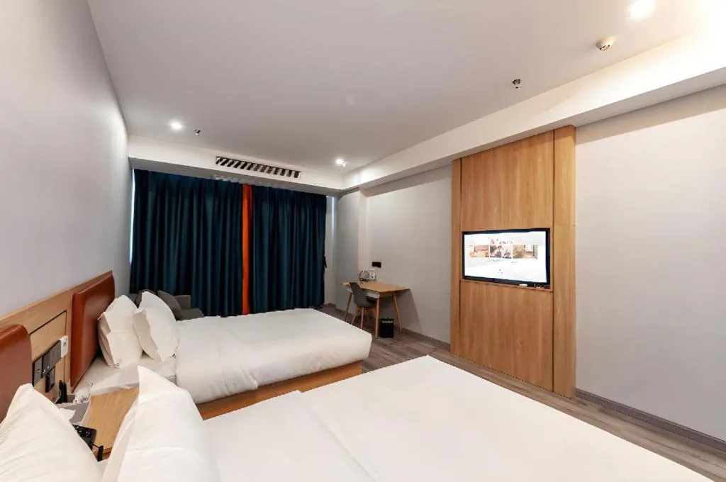 Bed in Borrman Hotel Jiangyin Zhouzhuang