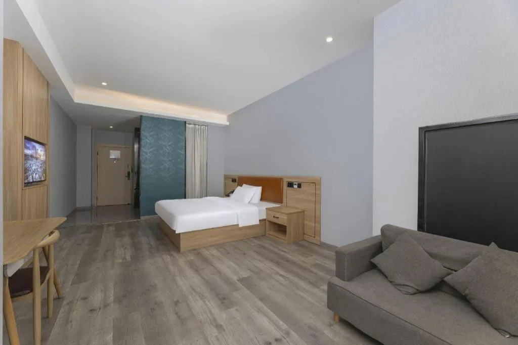 Bed in Borrman Hotel Jiangyin Zhouzhuang