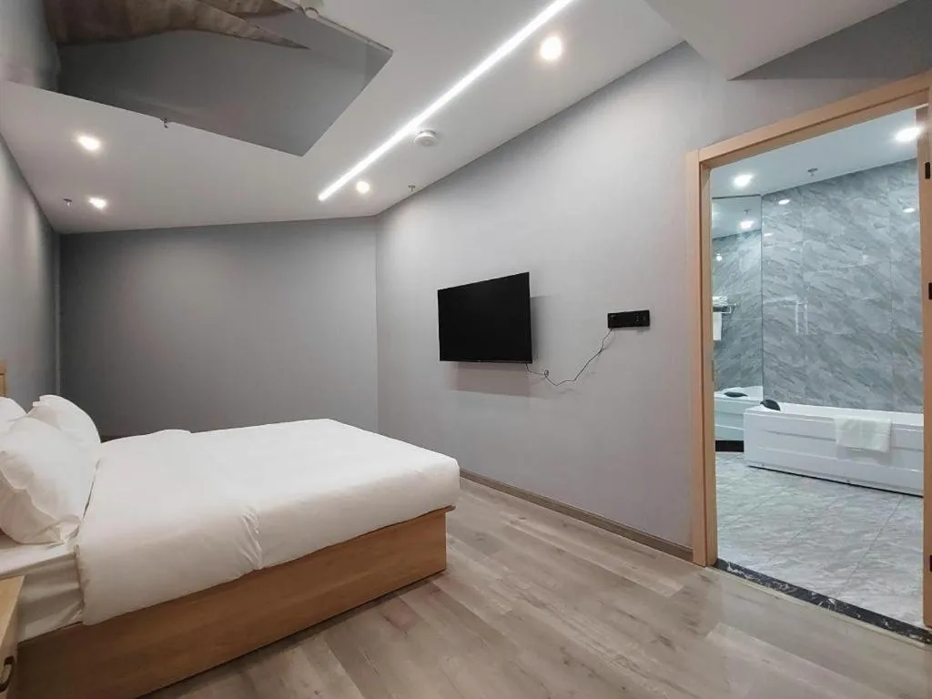 Bed in Borrman Hotel Jiangyin Zhouzhuang