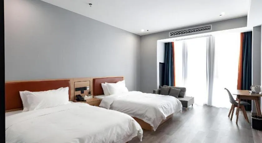 Bed in Borrman Hotel Jiangyin Zhouzhuang